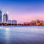 View of Abu Dhabi skyline and waterfront at sunset in relation to UAE company owner fines article.