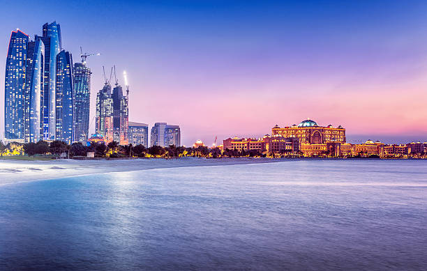 View of Abu Dhabi skyline and waterfront at sunset in relation to UAE company owner fines article.